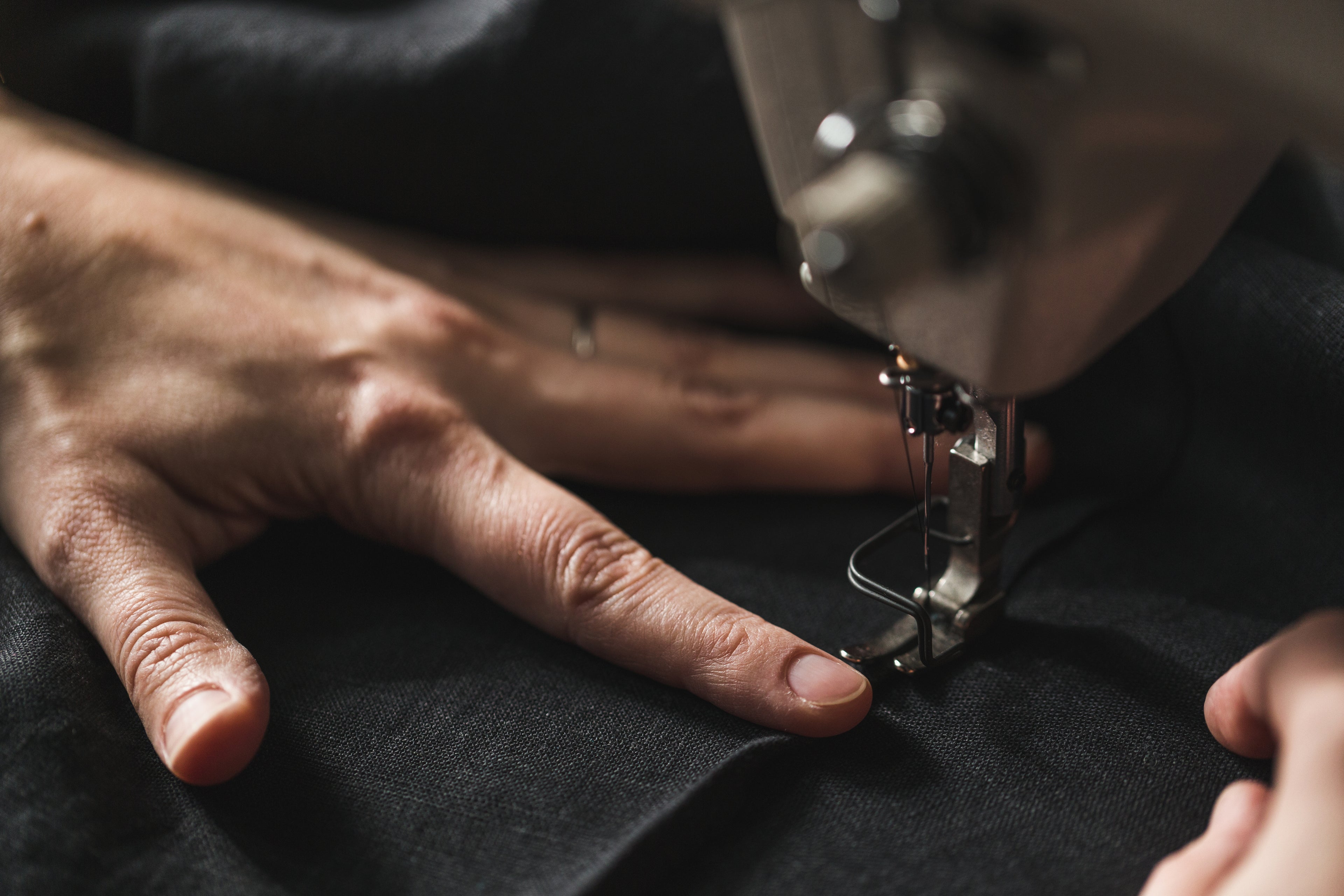 black-fabric-in-sewing-machine - SuitGamer